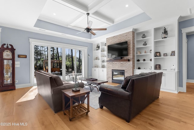 living room featuring a fireplace, coffered ceiling, light hardwood / wood-style floors, beam ceiling, and built in shelves