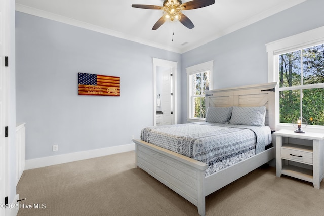 carpeted bedroom with multiple windows, crown molding, and ceiling fan