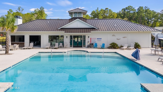 view of swimming pool with a patio