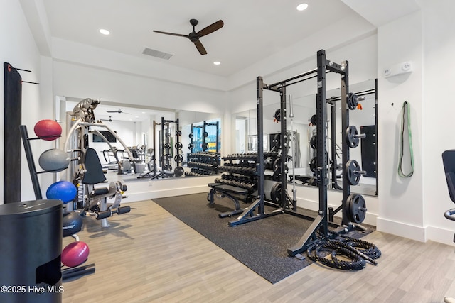 gym featuring wood-type flooring and ceiling fan