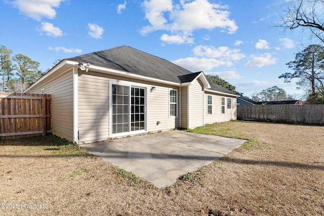 back of house with a patio