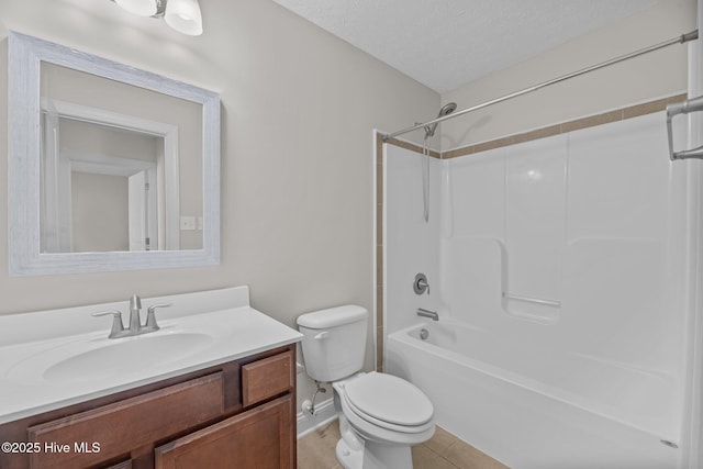 full bathroom with vanity, toilet, tub / shower combination, tile patterned floors, and a textured ceiling