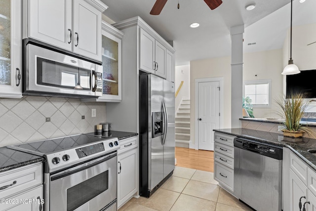 kitchen featuring light tile patterned floors, white cabinets, and appliances with stainless steel finishes