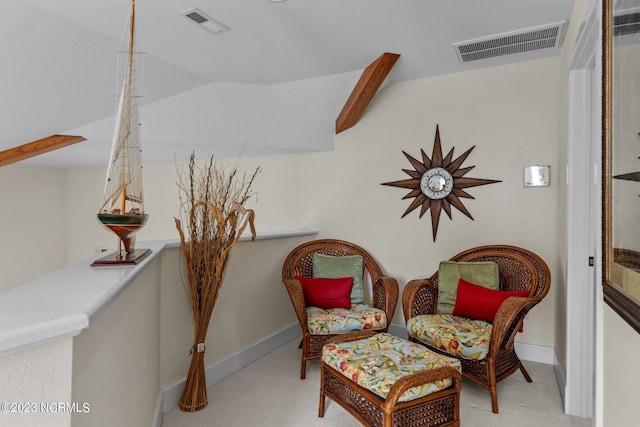 living area with light colored carpet and lofted ceiling