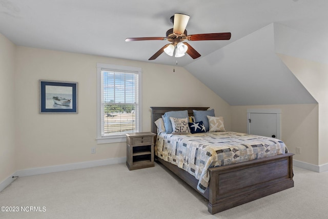 bedroom with light carpet, vaulted ceiling, and ceiling fan