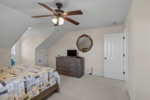 bedroom featuring ceiling fan, light colored carpet, and lofted ceiling