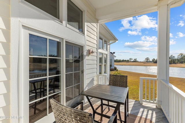 balcony featuring a water view