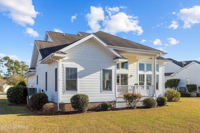 exterior space with a porch, central AC unit, and a lawn