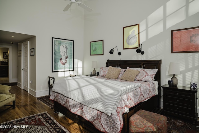 bedroom featuring ceiling fan and dark hardwood / wood-style floors