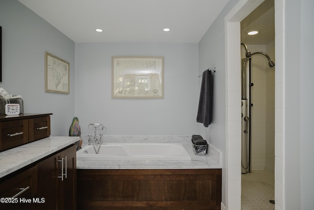 bathroom with separate shower and tub and vanity