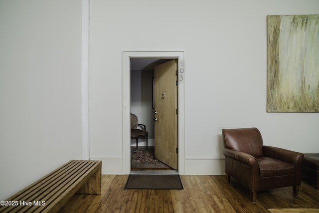 sitting room featuring dark wood-type flooring