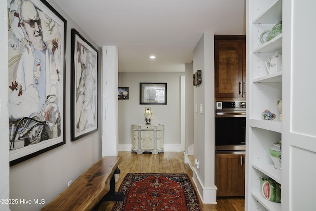 corridor featuring hardwood / wood-style floors