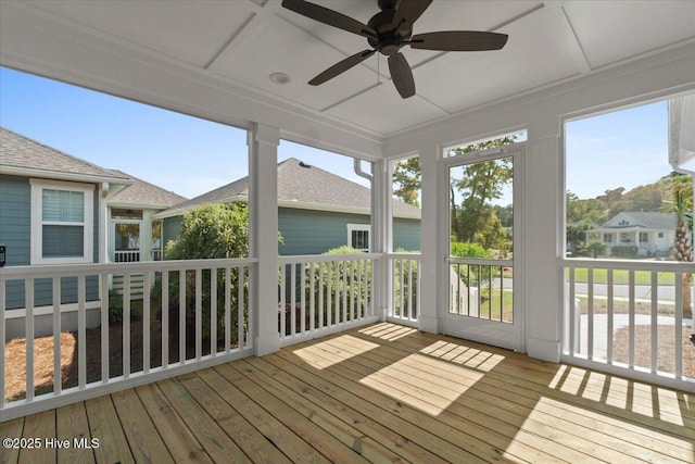 1665 Butterfly Knot Dr SW, Ocean Isle Beach, NC 28469 - unfurnished sunroom featuring a deck, ceiling fan, and hardwood / wood-style flooring