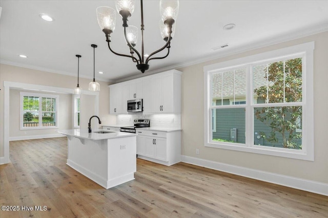 1665 Butterfly Knot Dr SW, Ocean Isle Beach, NC 28469 - kitchen with appliances with stainless steel finishes, a sink, crown molding, backsplash, and baseboards