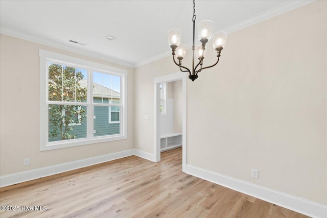1665 Butterfly Knot Dr SW, Ocean Isle Beach, NC 28469 - unfurnished dining area featuring ornamental molding, light wood finished floors, baseboards, and a chandelier