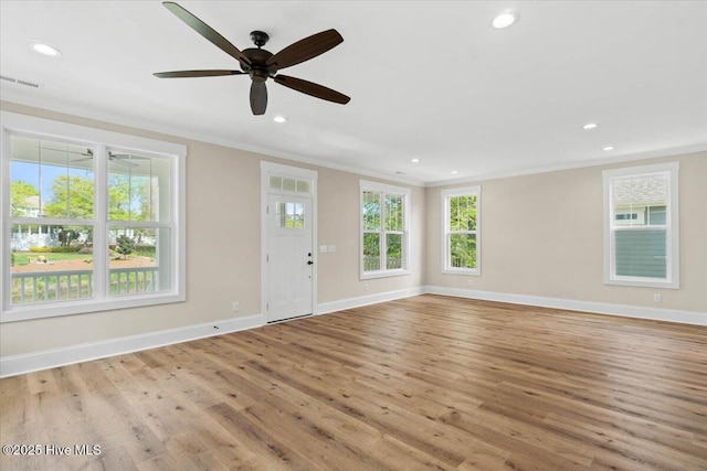 1665 Butterfly Knot Dr SW, Ocean Isle Beach, NC 28469 - entrance foyer featuring ornamental molding, wood finished floors, plenty of natural light, baseboards, and recessed lighting
