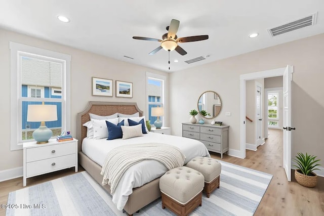 1665 Butterfly Knot Dr SW, Ocean Isle Beach, NC 28469 - bedroom with wood finished floors, baseboards, recessed lighting, and a ceiling fan
