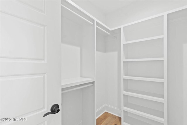 1665 Butterfly Knot Dr SW, Ocean Isle Beach, NC 28469 - spacious closet featuring wood finished floors