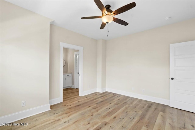 1665 Butterfly Knot Dr SW, Ocean Isle Beach, NC 28469 - empty room featuring a ceiling fan, light wood-type flooring, baseboards, and a smoke detector