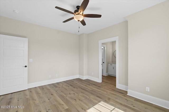 1665 Butterfly Knot Dr SW, Ocean Isle Beach, NC 28469 - unfurnished room with wood finished floors, a ceiling fan, and baseboards