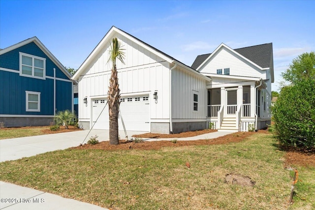 1665 Butterfly Knot Dr SW, Ocean Isle Beach, NC 28469 - modern farmhouse style home with board and batten siding, an attached garage, concrete driveway, a front yard, and a sunroom