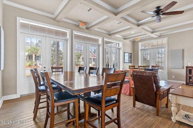 1665 Butterfly Knot Dr SW, Ocean Isle Beach, NC 28469 - dining area with french doors, beam ceiling, coffered ceiling, baseboards, and a ceiling fan