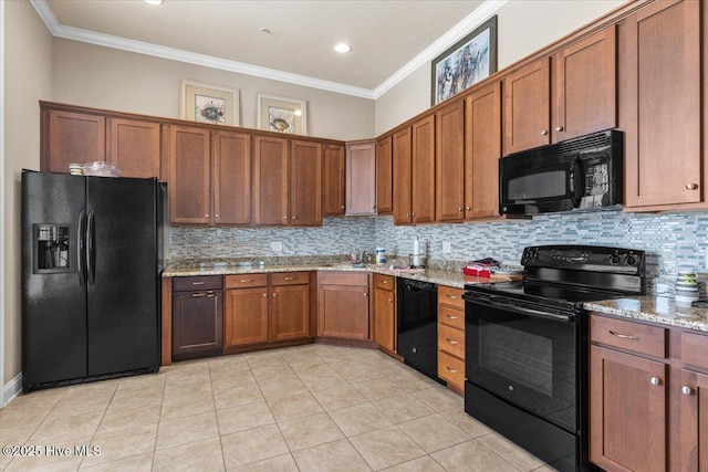 1665 Butterfly Knot Dr SW, Ocean Isle Beach, NC 28469 - kitchen featuring black appliances, ornamental molding, tasteful backsplash, and light stone counters