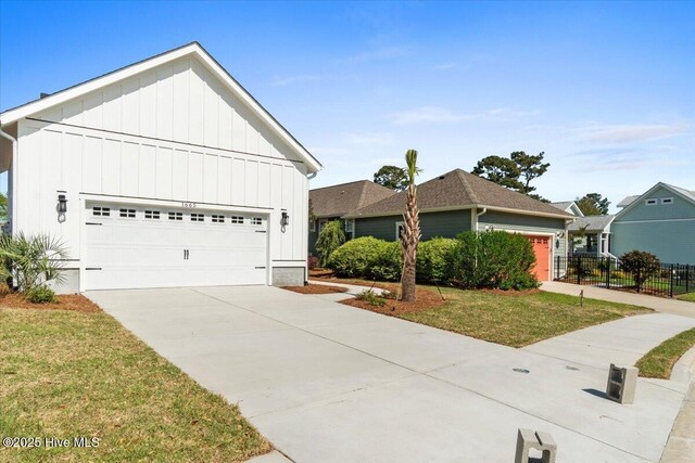 1665 Butterfly Knot Dr SW, Ocean Isle Beach, NC 28469 - ranch-style house featuring board and batten siding and a detached garage