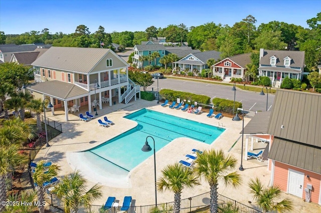 1665 Butterfly Knot Dr SW, Ocean Isle Beach, NC 28469 - community pool featuring a patio area and a residential view