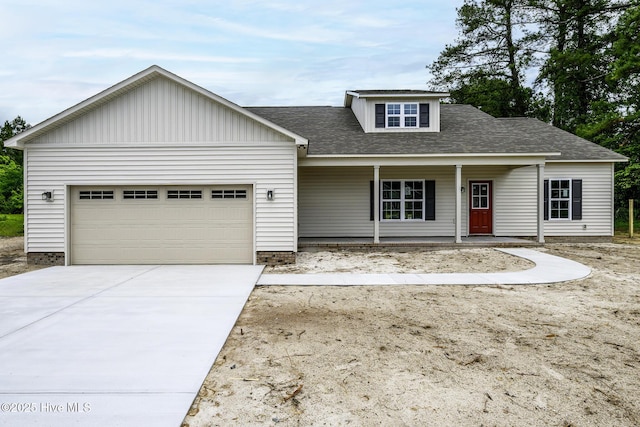 682 Crump Farm Rd, New Bern, NC 28562 - view of front facade featuring a porch, a garage, board and batten siding, roof with shingles, and concrete driveway