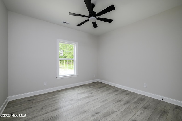 682 Crump Farm Rd, New Bern, NC 28562 - unfurnished room featuring baseboards, visible vents, wood finished floors, and ceiling fan