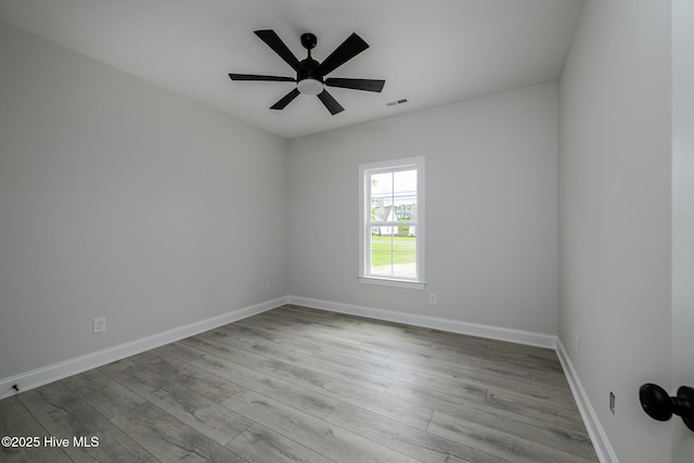 682 Crump Farm Rd, New Bern, NC 28562 - spare room featuring wood finished floors, visible vents, ceiling fan, and baseboards