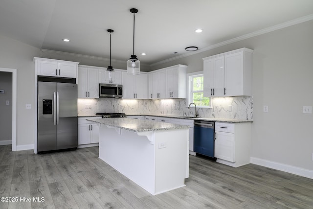 682 Crump Farm Rd, New Bern, NC 28562 - kitchen with white cabinetry, decorative backsplash, appliances with stainless steel finishes, a center island, and light stone countertops