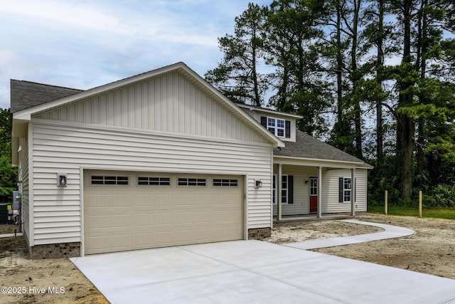 682 Crump Farm Rd, New Bern, NC 28562 - view of front of property featuring central AC unit, driveway, a garage, and roof with shingles