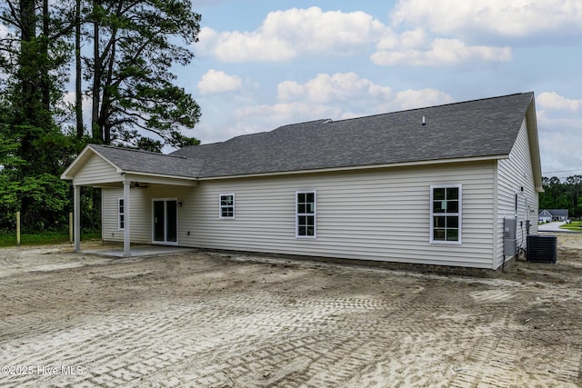 682 Crump Farm Rd, New Bern, NC 28562 - back of house featuring central AC, a shingled roof, and a patio area
