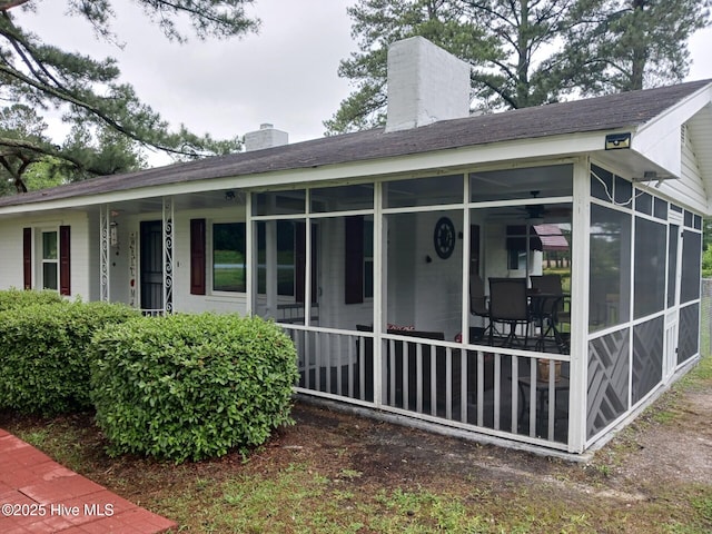 back of property featuring a sunroom