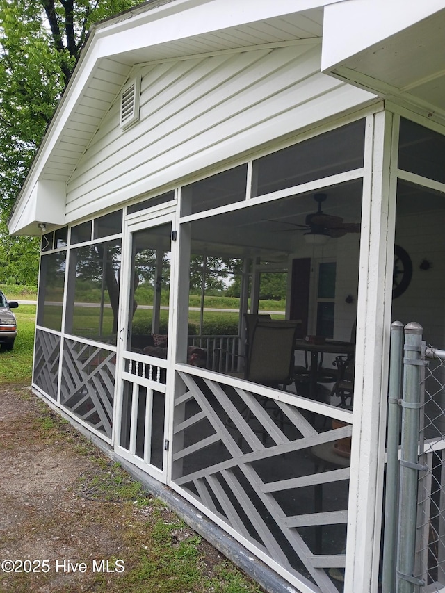 view of side of property with a sunroom