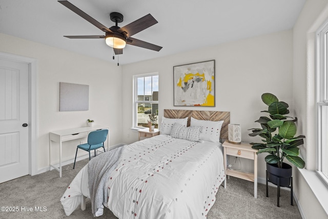 bedroom with ceiling fan and carpet floors