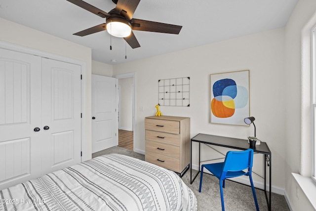 bedroom with ceiling fan, a closet, and carpet