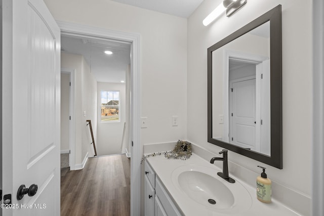 bathroom with vanity and hardwood / wood-style flooring