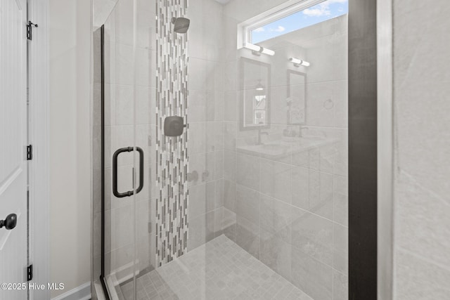 bathroom featuring a shower with door