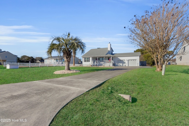 view of front of property featuring a garage and a front yard