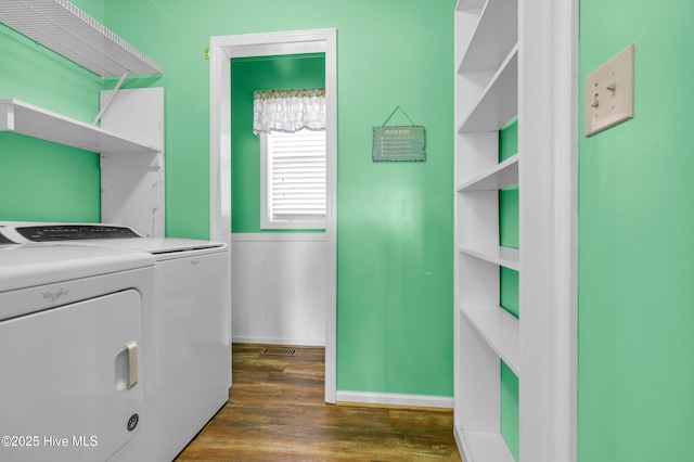 washroom with separate washer and dryer and dark hardwood / wood-style floors