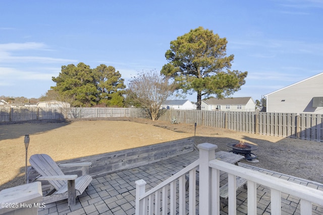 view of yard featuring a patio area and a fire pit