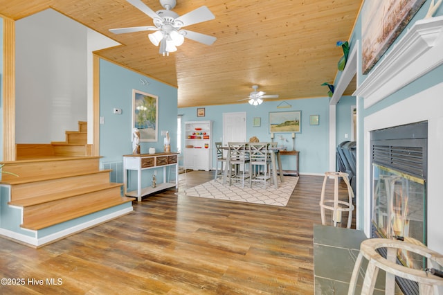 living room with wood ceiling, ceiling fan, and hardwood / wood-style floors