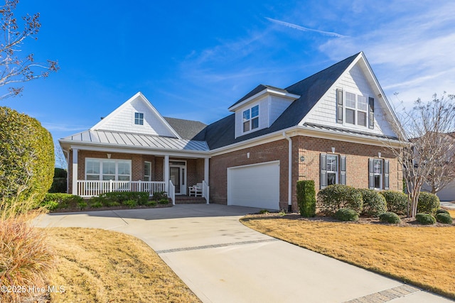 view of front of house with a garage and covered porch