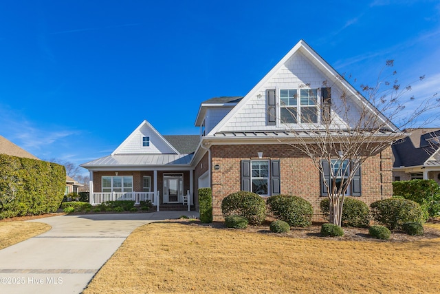 view of front of home featuring a front yard and covered porch