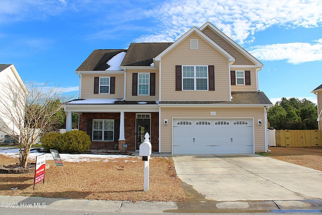 view of front of house featuring a garage and covered porch