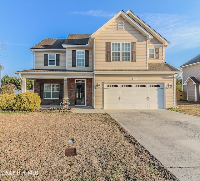 view of front of property featuring driveway and an attached garage