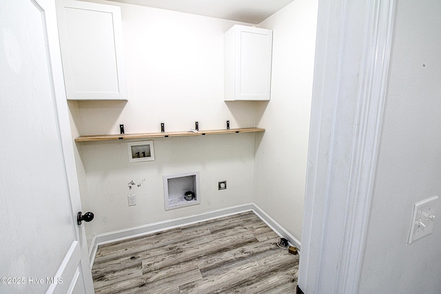 washroom with washer hookup, wood finished floors, baseboards, cabinet space, and electric dryer hookup